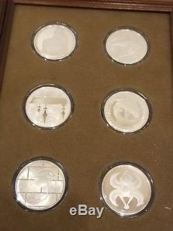 FRANKLIN MINT COLLECTION OF 12 STERLING SILVER GOOD LUCK MEDALS 9.2 OZ framed