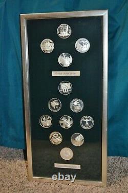 Framed Collection Of 14 Franklin Mint Sterling Silver Commemorative Medals