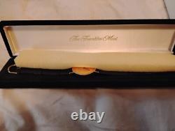 The Franklin Mint Eagle Coin Watch Gold Tone 32mm. 925 STERLING DIAL, untested